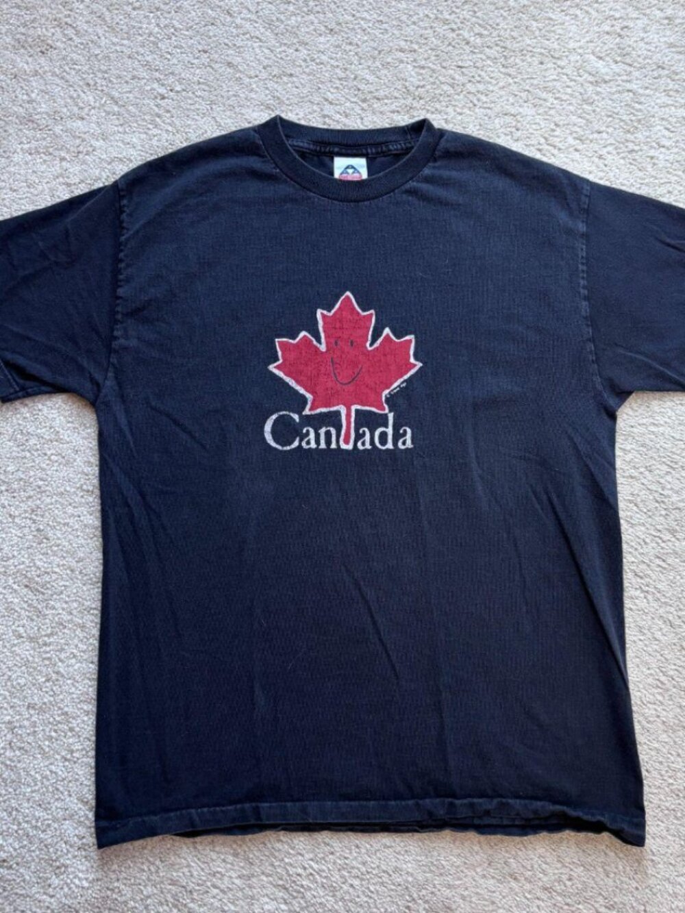 Y2K 2002 Canada Leaf Black T-shirt, cotton is perfectly worn in.
